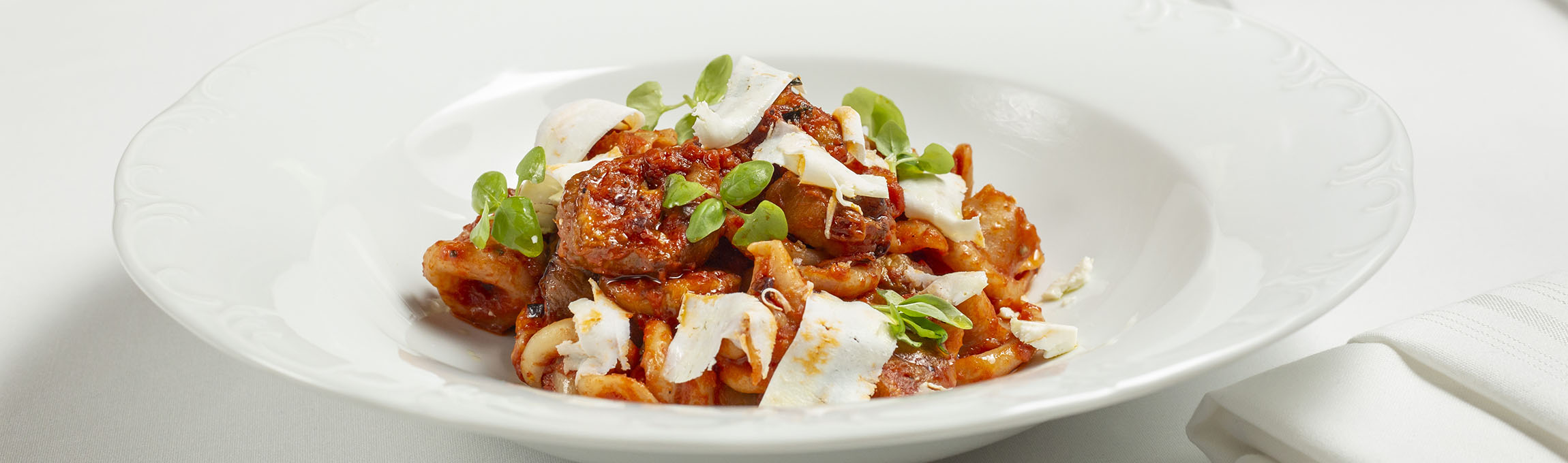 Plated pasta with shaved Parmigiana-Reggiano cheese served at Cento Italian restaurant in Columbus, Ohio's German Village neighborhood.